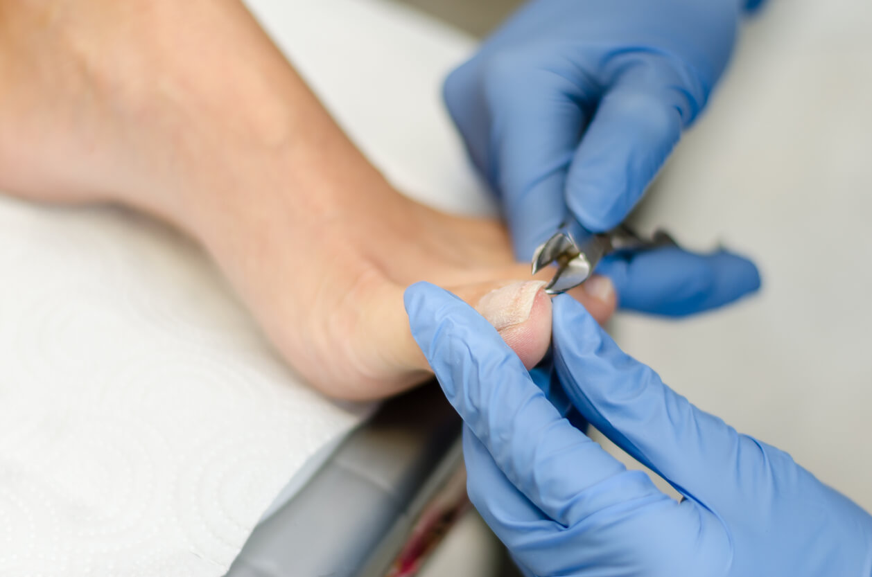 Image showing a client having nail cutting and filing
