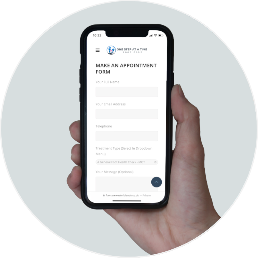 Person holding their phone about to request an appointment through the website